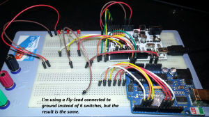 Two Arduinos on a breadboard connected over an I2c connection