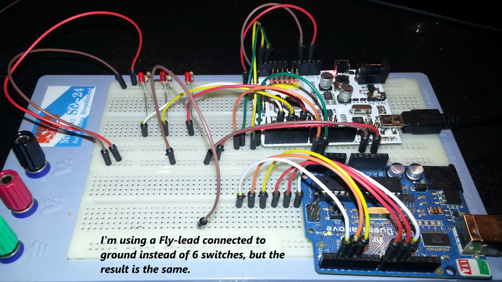 Two Arduinos on a breadboard connected over an I2c connection